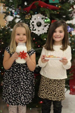 preschool_girls_with_milk_and_cookies_for_santa_cadence_academy_preschool_steele_creek_charlotte_nc-300x450
