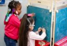 preschool_girls_writing_cadence_academy_north_aurora_il-659x450