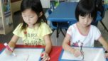 preschool_girls_writing_the_letter_e_prime_time_early_learning_centers_edgewater_nj-752x423