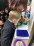 preschool_magnifiying_glass_activity_cadence_academy_preschool_yelm_highway_olympia_wa-338x450