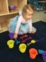 preschool_princess_playing_with_buckets_and_sand_toys_cadence_academy_preschool_iowa_city_ia-336x450