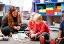 preschool_teacher_on_floor_with_students_cadence_academy_algonquin_il-648x450