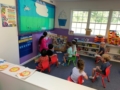 preschool_teacher_reading_to_students_creative_kids_childcare_centers_mahopac-600x450