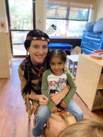 preschooler_and_teacher_in_native_american_clothing_at_sunbrook_academy_at_luella_mcdonough_ga-338x450