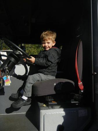 preschooler_driving_a_fire_truck_creative_kids_childcare_centers_kent-338x450