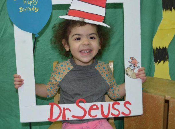 preschooler_enjoying_dr_seuss_birthday_cadence_academy_preschool_sleater-kinney_olympia_wa-611x450