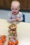 preschooler_enjoying_thanksgiving_trail_mix_cadence_academy_preschool_urbandale_ia-302x450