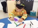 preschooler_in_fireman_gear_gateway_academy_mckee_charlotte_nc-603x450