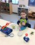 preschooler_looking_through_magnifying_glass_adventures_in_learning_aurora_il-356x450