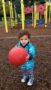 preschooler_playing_with_kick_ball_on_playground_cadence_academy_preschool_milwaukie_portland_or-253x450