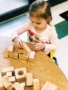 preschooler_playing_with_wood_blocks_cadence_academy_preschool_mount_pleasant_sc-338x450