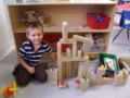 preschooler_playing_with_wooden_blocks_and_bears_cadence_academy_preschool_centennial_co-599x450