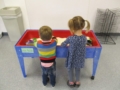preschoolers-playing_with_rice_table_adventures_in_learning_oswego_il-600x450