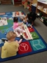preschoolers_and_teacher_playing_with_legos_smaller_scholars_montessori_academy_grisby_tx-338x450