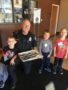 preschoolers_bringing_treat_to_police_station-canterbury_academy_at_shawnee_crossings_shawnee_ks-338x450