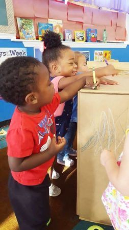 preschoolers_coloring_cardboard_box_cadence_academy_preschool_surfside_myrtle_beach_sc-253x450