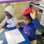 preschoolers_drawing_on_white_board_at_cadence_academy_preschool_northeast_columbia_sc-448x450