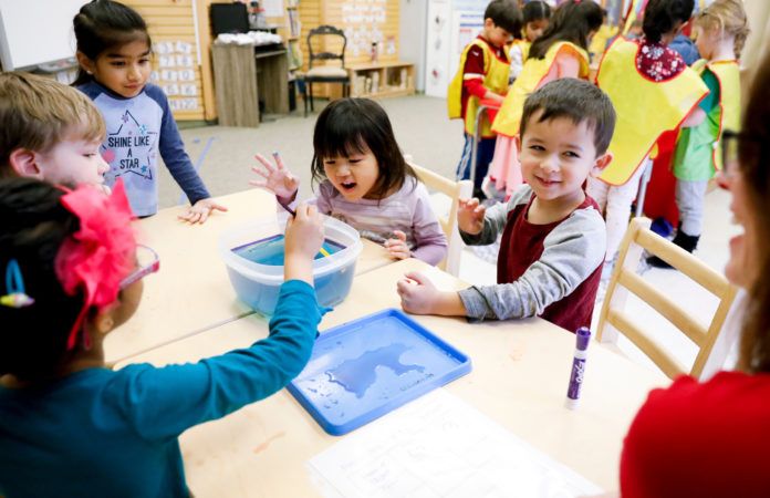 preschoolers_enjoying_penny_science_activity_winwood_childrens_center_brambleton_va-696x450