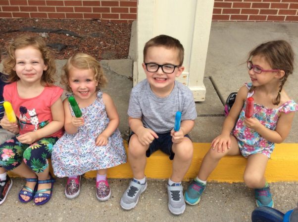 preschoolers_enjoying_popsicles_outside_cadence_academy_preschool_ashworth_west_des_moines_ia-602x450