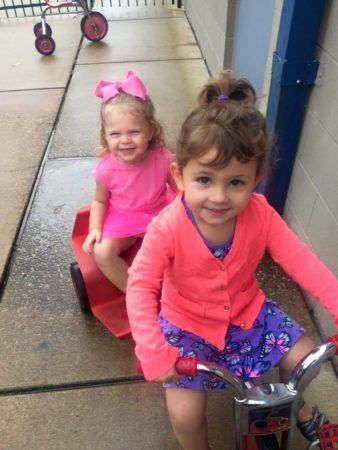 preschoolers_enjoying_ride_on_tricycle_creative_expressions_learning_center_eureka_mo-338x450