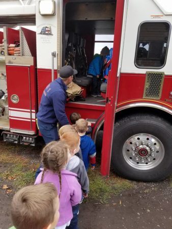 preschoolers_exploring_fire_truck_cadence_academy_preschool_childrens_center_klamath_falls_or-338x450