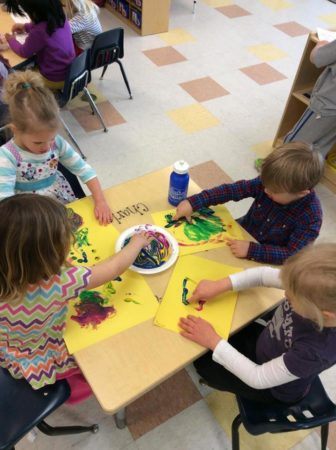 preschoolers_fingerpainting_together_canterbury_academy_at_small_beginnings_overland_park_ks-336x450