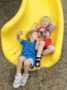 preschoolers_going_down_slide_at_cadence_academy_preschool_myrtle_beach_sc-336x450