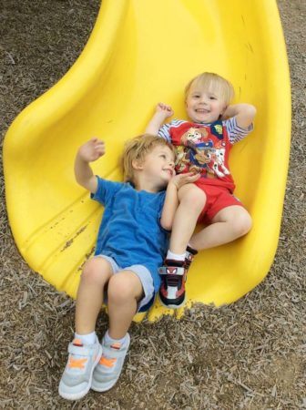 preschoolers_going_down_slide_at_cadence_academy_preschool_myrtle_beach_sc-336x450