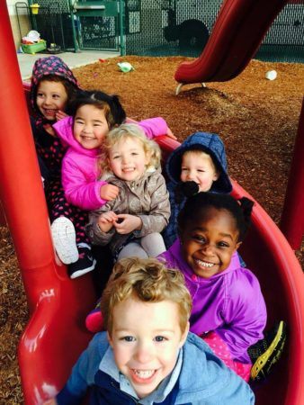 preschoolers_going_down_slide_cadence_academy_preschool_sherwood_or-338x450