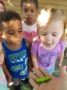 preschoolers_looking_at_caterpillar_rogys_learning_place_lake_street_peoria_heights_il-336x450