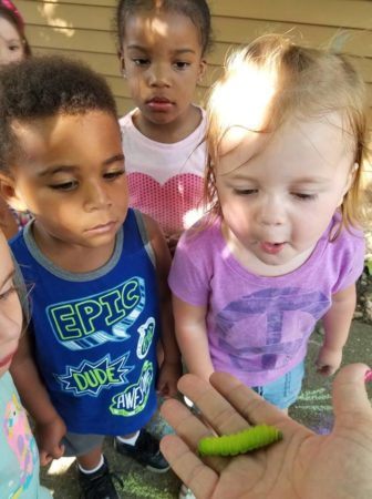 preschoolers_looking_at_caterpillar_rogys_learning_place_lake_street_peoria_heights_il-336x450