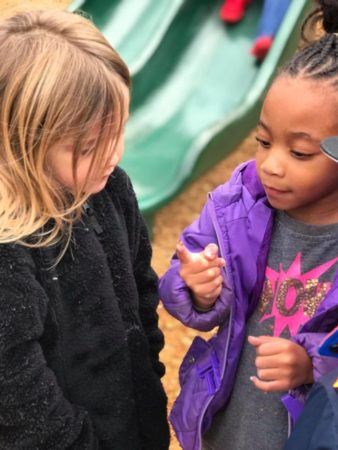 preschoolers_looking_at_lady_bug_mirror_lake_academy_villa_rica_ga-338x450