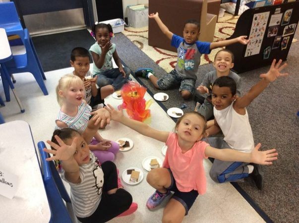 preschoolers_making_smores_around_indoor_campfire_rogys_learning_place_glen_oak_peoria_heights_il-603x450