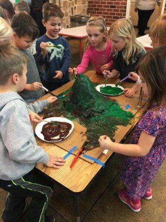 preschoolers_painting_a_volcano_canterbury_academy_at_shawnee_crossings_shawnee_ks-338x450