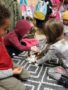 preschoolers_petting_rabbit_cadence_academy_preschool_portland_or-338x450