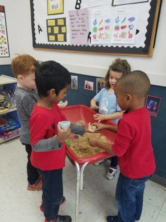 preschoolers_playing_in_sand_winwood_childrens_center_fairfax_va-338x450