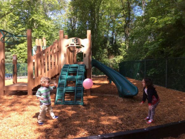 preschoolers_playing_with_balloon_on_playground_cadence_academy_preschool_west_bridgewater_ma-599x450