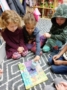 preschoolers_playing_with_dreidel_cadence_academy_preschool_portland_or-336x450