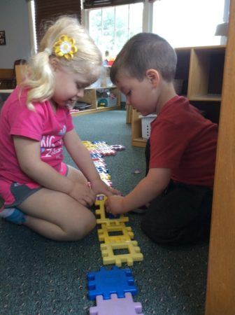 preschoolers_playing_with_interlocking_blocks_next_generation_childrens_centers_westford_ma-336x450