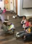 preschoolers_reading_dr_seuss_books_together_childrens_garden_montessori_richland_wa-336x450