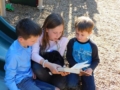 preschoolers_reading_together_on_playground_stonebridge_academy_bremen_ga-600x450