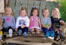 preschoolers sitting on the porch