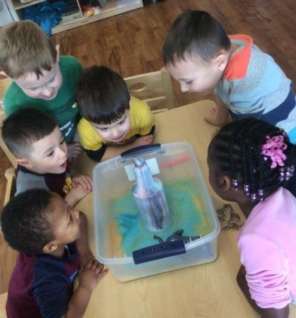 preschoolers_watching_fizzy_science_experiement_at_cadence_academy_preschool_raynham_ma-419x450