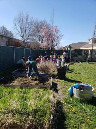 preschoolers_working_in_the_garden_cadence_academy_preschool_childrens_center_klamath_falls_or-336x450