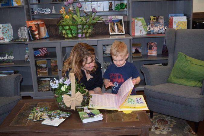 reading_a_book_in_the_lobby_at_cadence_academy_preschool_rogers_ar-675x450