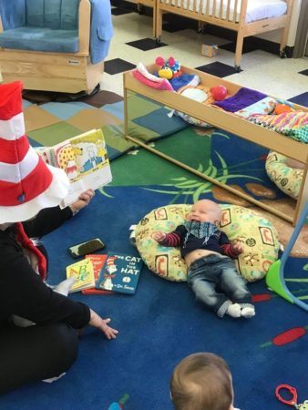 reading_to_infants_at_phoenix_childrens_academy_private_preschool_union_hills-338x450