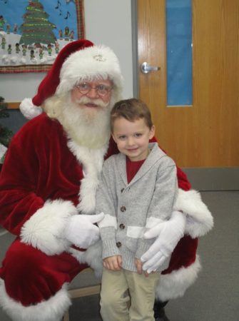 santa_and_happy_preschool_boy_adventures_in_learning_oswego_il-335x450