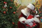 santa_giving_preschool_girl_a_hug_winwood_childrens_center_fairfax_va-675x450