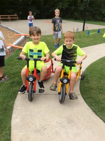 school_age_boys_riding_carriage_trikes_sunbrook_academy_at_woodstock_ga-336x450