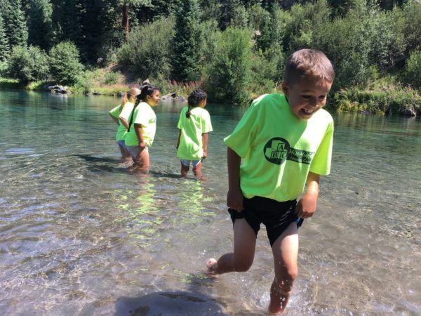 school_age_child_trying_to_avoid_getting_wet_in-river_miss_muffets_learning_center-600x450